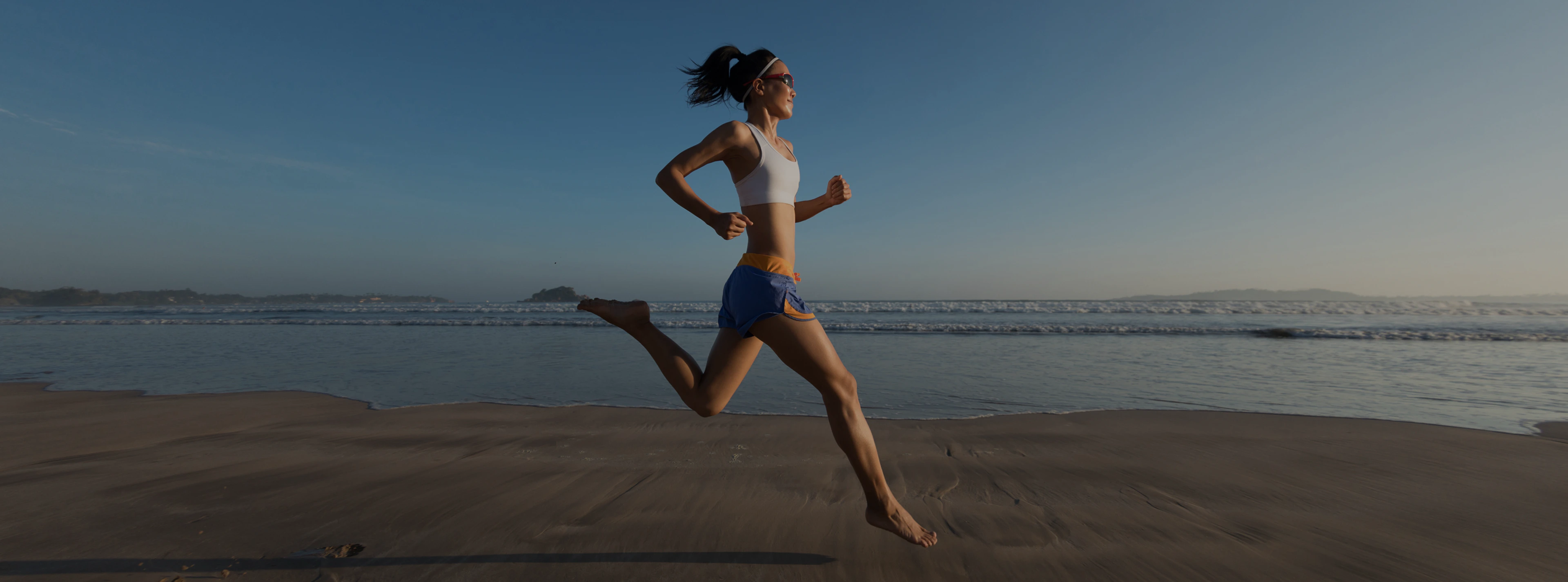 A woman running on a beach