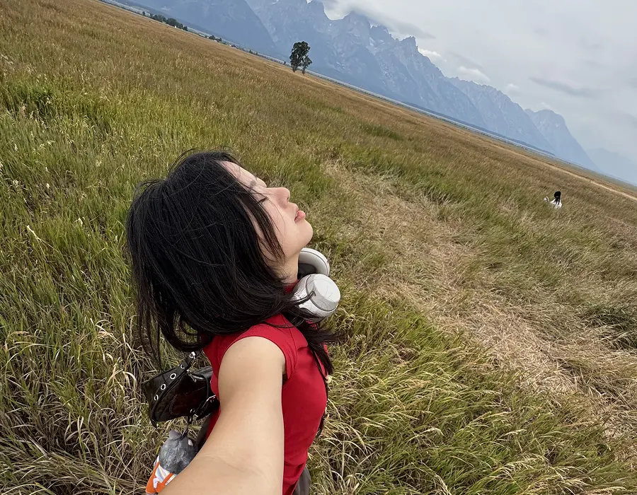 Wenjun Gong in a mountain meadow